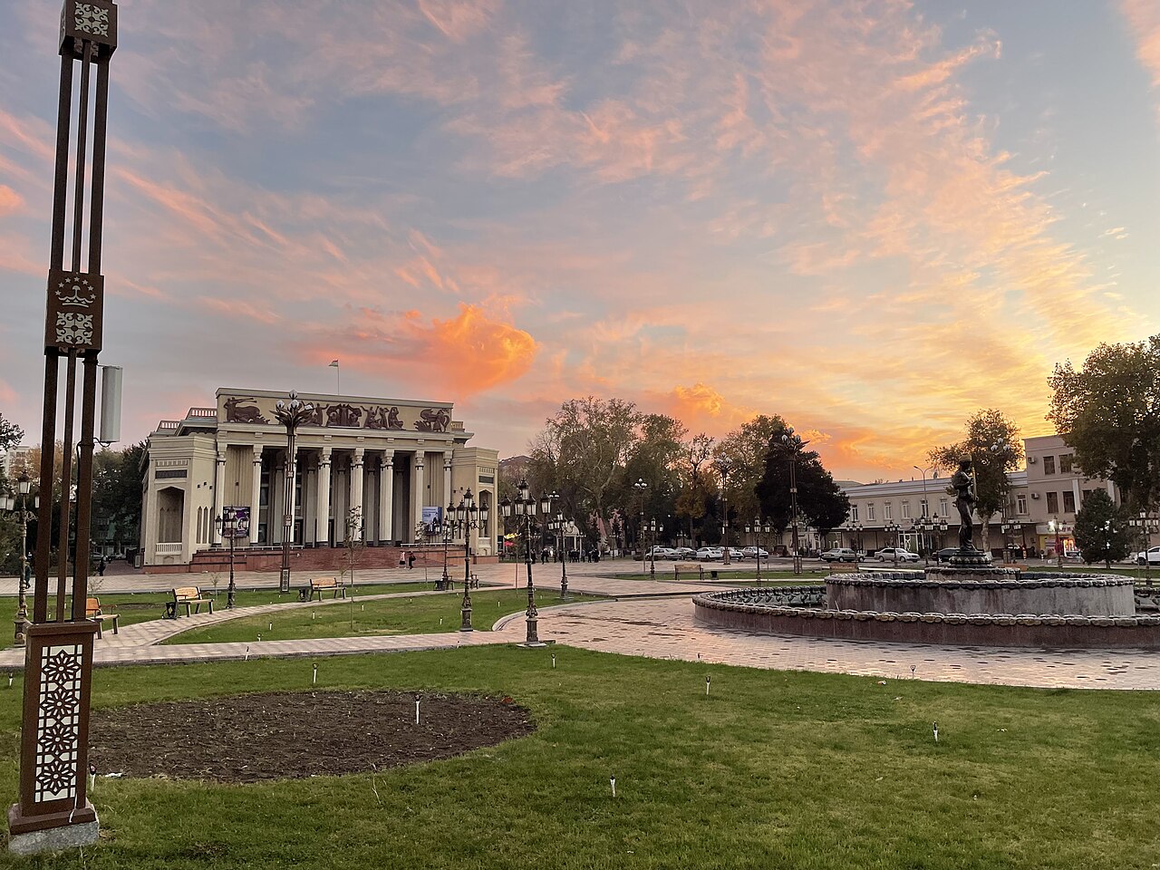 Kamol Khujandi State Musical and Comedy Theater and its square at sunset